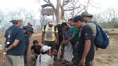 Naturalists learning about camera traps